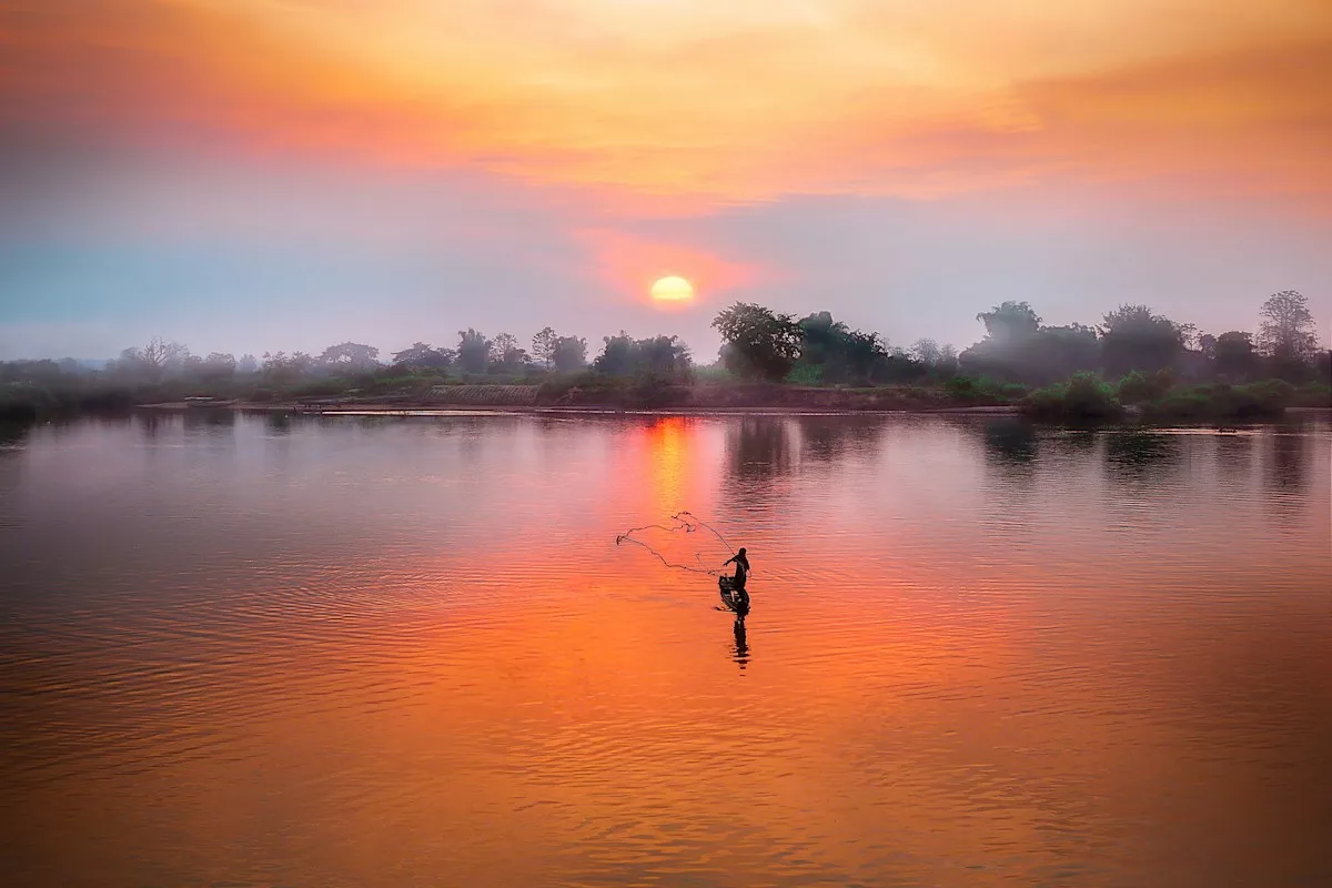 body of water during sunset