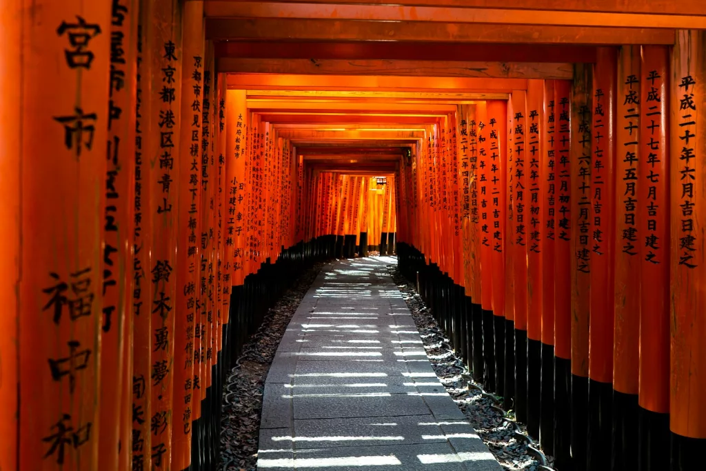 empty tunnel between red walls in japan