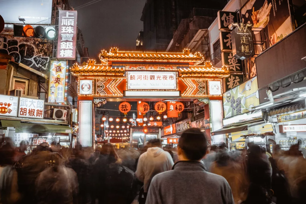 group of people walking at street in Taipei